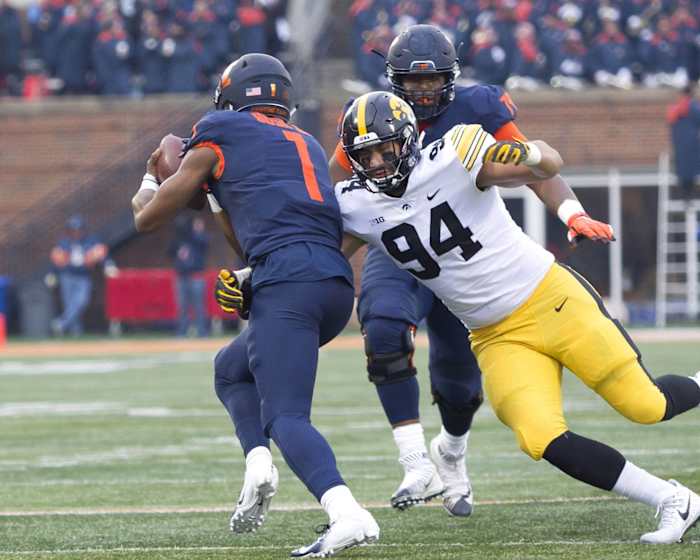Nov 17, 2018; Champaign, IL, USA; Iowa Hawkeyes defensive end A.J. Epenesa (94) sacks Illinois Fighting Illini quarterback AJ Bush Jr. (1) during the second quarter at Memorial Stadium.